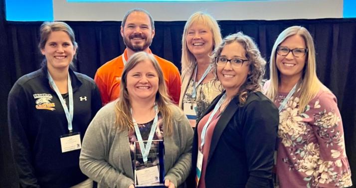 Representatives from Hawkeye Community College accept the Exemplary Noncredit Workforce Program Award during the National Council for Workforce Education Conference in Baltimore, Maryland. 